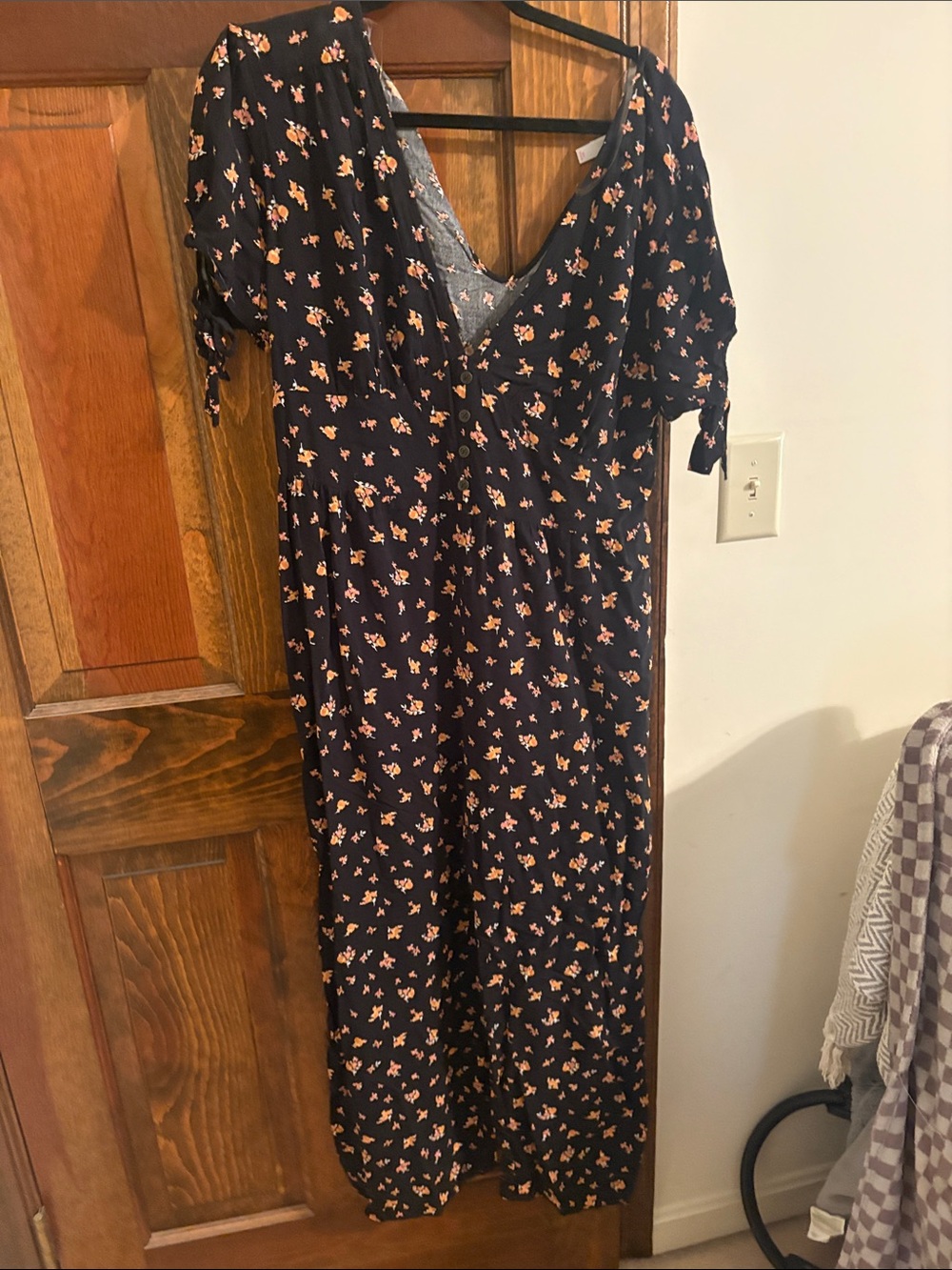 Xhiliration black Floral jumpsuit with Peach Accent Print